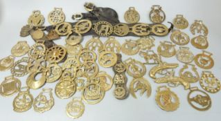 Horse brasses, mostly 19th/20thC, some mounted on leather tack