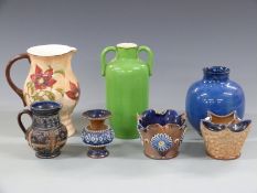 A collection of Royal Doulton vases, ewers and jugs including one by Henry Walker