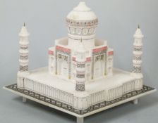 A carved alabaster model of the Taj Mahal, H17 x 22 x 22cm