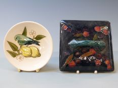 Moorcroft pin dish decorated with a bird and lemons, diameter 11.5cm and a Moorcroft lid with handle