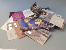 An album of Great Britain coin/stamp covers and stamp booklets including over £50 in redeemable
