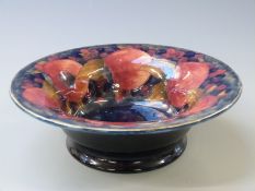 William Moorcroft pedestal bowl in Pomegranate pattern on an early pale green/blue ground, signature