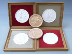 Four framed relief moulded Copenhagen plaques of classical scenes and two similar unframed