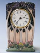 Moorcroft clock with tube lined decoration of trees, 16cm tall