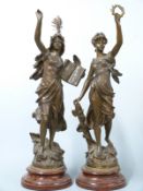 A pair of large spelter figures on plinths Livre D'or and La Gloire, tallest 70cm