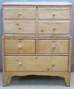 Pine two-piece blanket box, the top section having lift up lid and four false drawers to front,