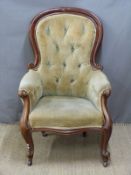19thC mahogany button-back upholstered armchair with scrolling arms, raised on cabriole legs and
