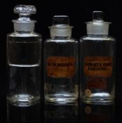 Three chemists/ pharmacy glass apothecary bottles with labels including Quin Bisulp, largest 17.