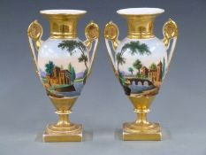 Pair of continental pedestal twin handled vases, 25.5cm tall