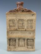 A 19thC salt glazed Reform flask in the form of a pub or house, with relief moulded decoration and