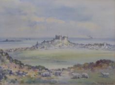 Frank W Wood (1905-1985) watercolour Banburgh Castle in a seascape with sheep in the foreground,