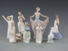 A collection of Lladro, Nao and a similar figures, some boxed, tallest 28cm
