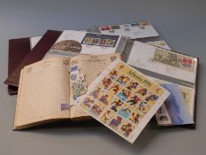 Two albums of first day covers and a book of stamps