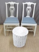 Two white painted chairs and a similar linen basket