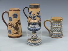 Doulton Lambeth and Slaters jugs and a candlestick including jug with EP monogram, probably for