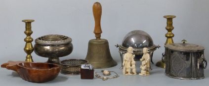 A hand bell, plated ware, brass candlesticks etc, bone okimono etc