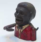 A novelty Negro cast iron mechanical money bank, 14cm tall