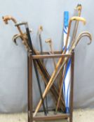 A stick stand and sticks including silver-mounted horn, deer antler etc