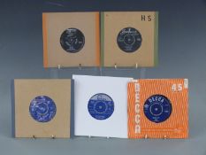 Approximately 30 singles in a case by The Who, Them and The Pretty Things