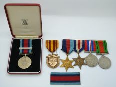 British Army WWII medals comprising 1939/1945 Star, France and Germany Star, War Medal and Defence