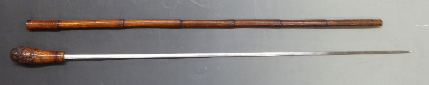 An early 20thC bamboo swordstick with 75cm graduated steel blade, overall length 88cm.