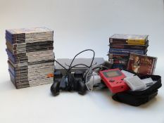 Nintendo Game Boy and five games in Nintendo carry case together with a Playstation with three
