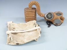 WWII standard issue gas mask with canvas bag dated 1942