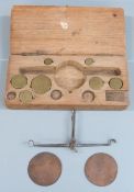 Cased set of 18thC travelling beam scales with flat copper pans and brass weights. Width of case
