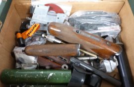 A collection of gun parts and accessories including forends, sound moderators, magazines, springs,