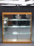 Oak glazed shop fitting or haberdashery display cabinet with sliding doors, adjustable glass shelves
