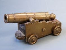 Bronze signalling or desk cannon with mahogany and bronze carriage and 5.5 inch multi-stage barrel