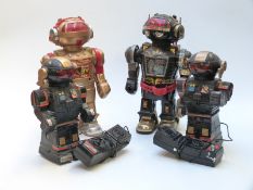 Four battery operated robots including Walking Talking Toby, two remote control