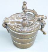 Cased set of nesting cup weights with handle to outer case, height 9.5cm