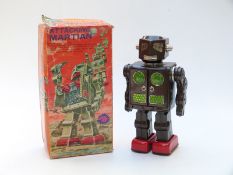 Japanese battery operated tinplate Attacking Martian robot, in original box.