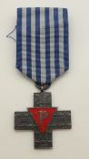 A reproduction WWII Polish Auschwitz cross