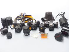 A quantity of Olympus OM system cameras, lenses and accessories including OM40 program with 1:1.8