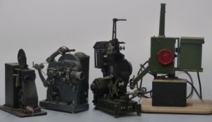 Four 9.5mm cine film projectors comprising Paillard, Pathescope, and two hand-cranked examples