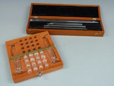 Cased set of County of Monmouth standard pipettes, marked with portcullis marks from George V to