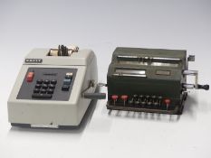 Two Facit vintage mechanical calculators, the older example numbered  218565