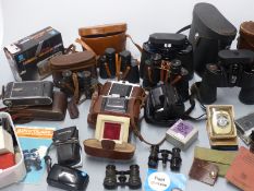 Quantity of binoculars and cameras including Swift 10x50 and 7x50, Eikow 8x40, Zenith 8x30, Zeiss