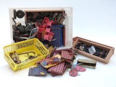 A large collection of loose Meccano pieces