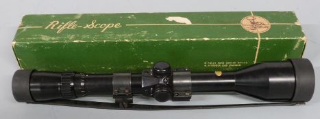 Bisley Deluxe triple tested 3-12x40 rifle scope, in original box with instructions