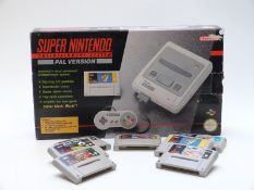 Super Nintendo Entertainment System PAL Version in original box together with seven games comprising