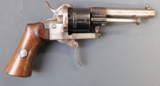 Belgian 7mm pinfire six-shot double action revolver with shaped wooden grips, folding trigger and