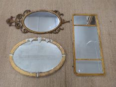 Triptych mirror with bevelled glass, 104 x 45cm overall, and two oval mirrors