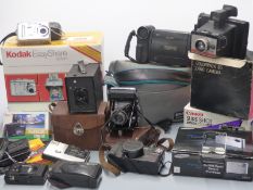 Quantity of cameras and accessories including Kodak EasyShare printer, Canon Sureshot Megazoom