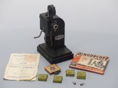 Bingoscope 9.5m hand-cranked cine projector together with a quantity of Pathescope Mickey Mouse