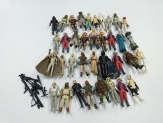 Thirty six Kenner and Palitoy LFL Star Wars figures and figurines together with various guns and