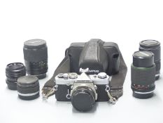 Olympus OM-1 SLR camera with 50mm 1:1.8, 28mm 1:3.5 and 135mm 1:2.8 olympus lenses and Hanimex 75-