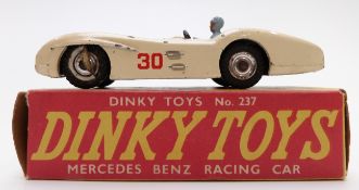 Dinky Toys diecast model Mercedes Benz Racing Car with cream body, red interior, blue driver and